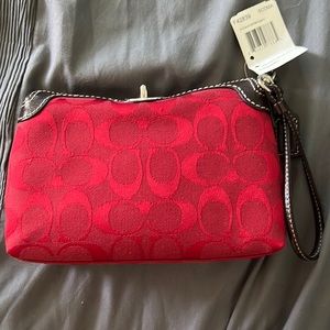 Red and black Coach wrist wallet